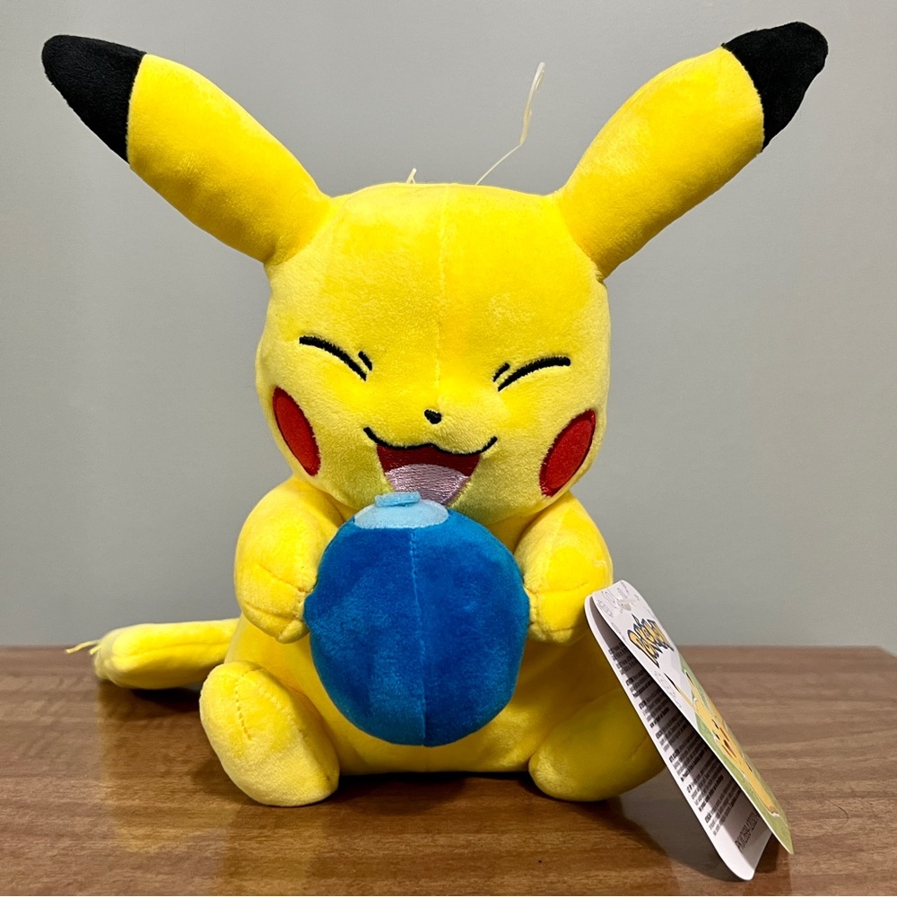Pokemon Pikachu plush with Oran Berry